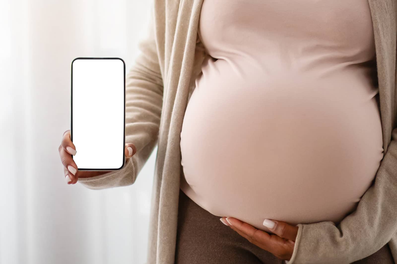 App screen shown in mama's hand